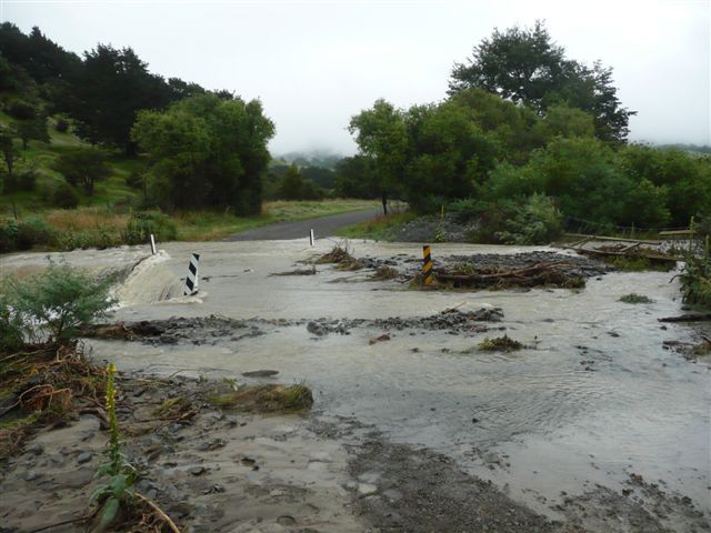 The overflowing culvert which forced Plan C