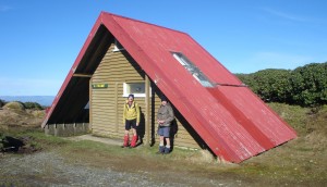 Travers Hut, with Gordon Tapp and Les O'Shea keeping out of the wind
